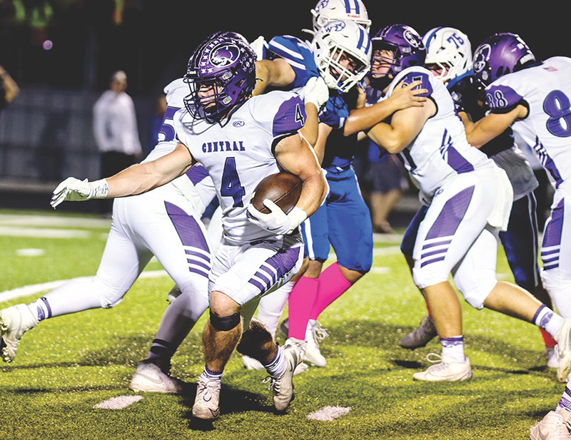 Conference champs — Central senior tail back Cole Davis runs for an 18-yard gain in the Cougars’ 41-6 win at Columbia on Friday.  The win allowed the Cougars to have a perfect Cahokia Conference season.    PHOTO BY CRAIG HUEGEN DavisCC