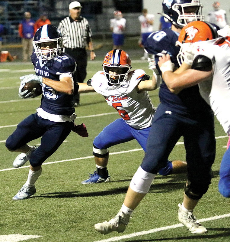 Turning the corner — Mater Dei senior tail back Brett Hilmes gets the edge for Mater Dei in the second quarter of their rout over St. Teresa on Friday in Breese.  Hilmes had 31 yards rushing and one reception for MD.           PHOTO BY JEREMY CHAWGO HilmesCC