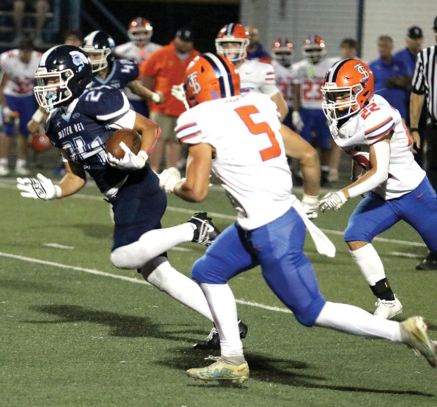 To the house — Mater Dei defensive star Dylan Souder takes a pick-six to the house in the Knights record-tying win on Friday in Breese.  The 65-39 win tied for the most points in a game in school history for MD.                 PHOTO BY JEREMY CHAWGO SouderCC